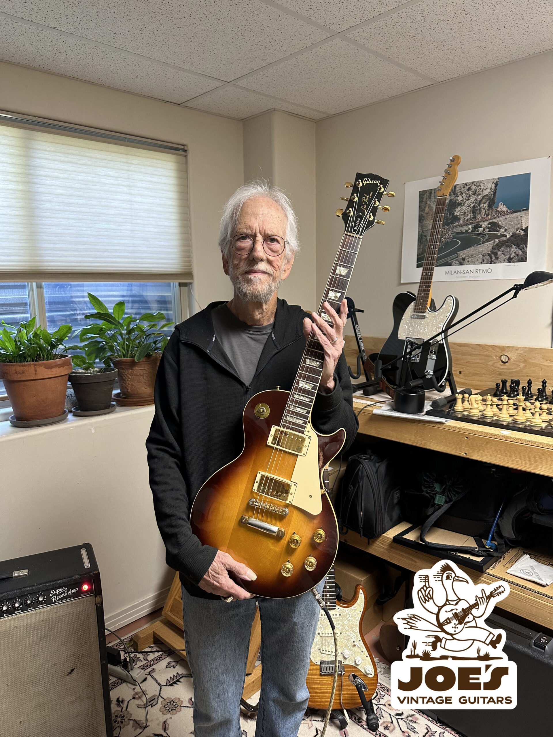 Happy Client Holding a Vintage Gibson Les Paul