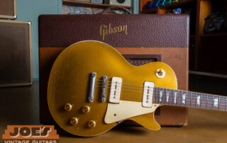 1956 Gibson Les Paul Goldtop with P-90 pickups and no-wire ABR-1 bridge leaning against a vintage 1950s Gibson Les Paul GA-40 amplifier.