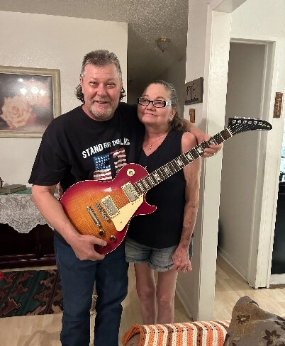 Vintage guitar owner receiving free expert market valuation from Joe's Vintage Guitars specialist informal appraisal based on real sales data