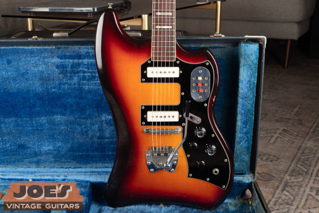 Detailed body shot of a vintage 1960s Guild Thunderbird S-200 electric guitar, showcasing its unique offset body shape, sunburst finish, and original dual-pickup configuration.